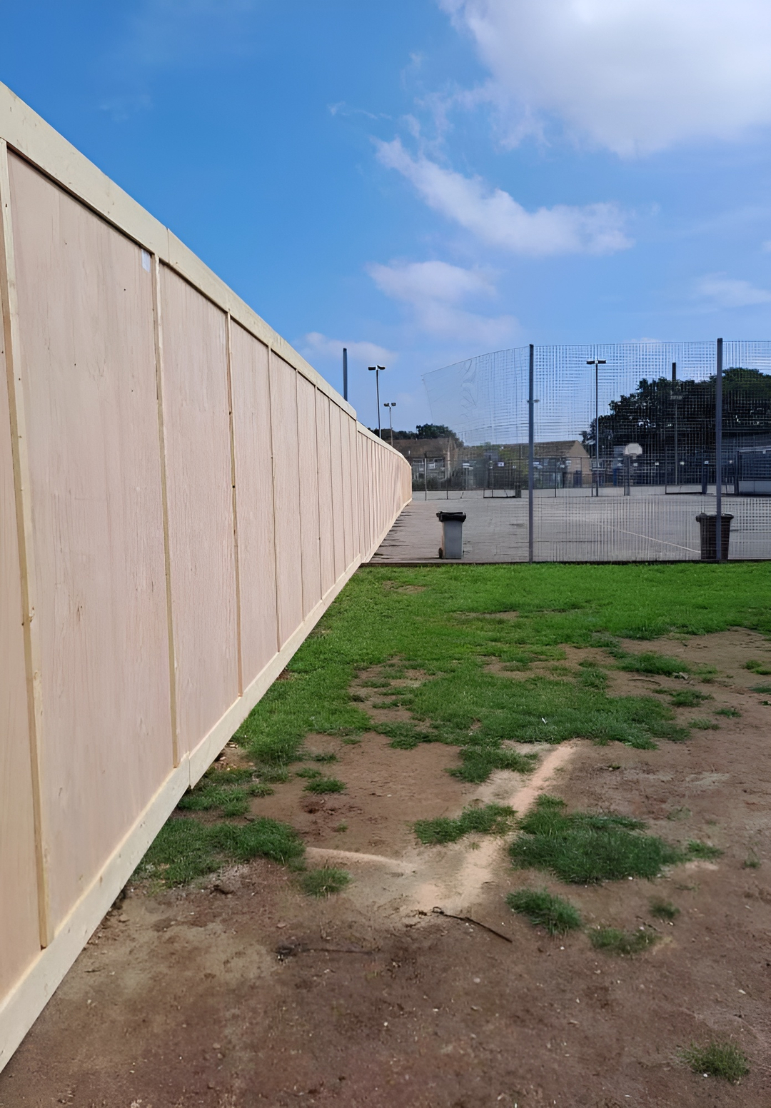 dug-in timber hoarding