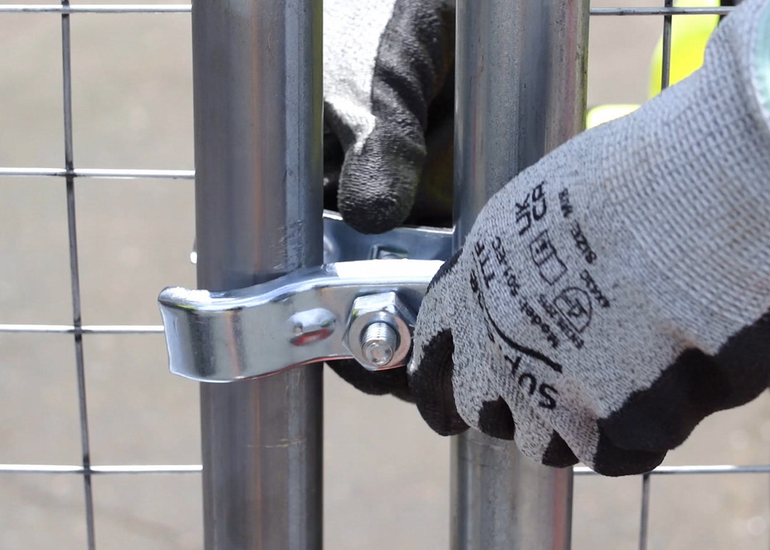 coupler being installed with worker on fencing to connect