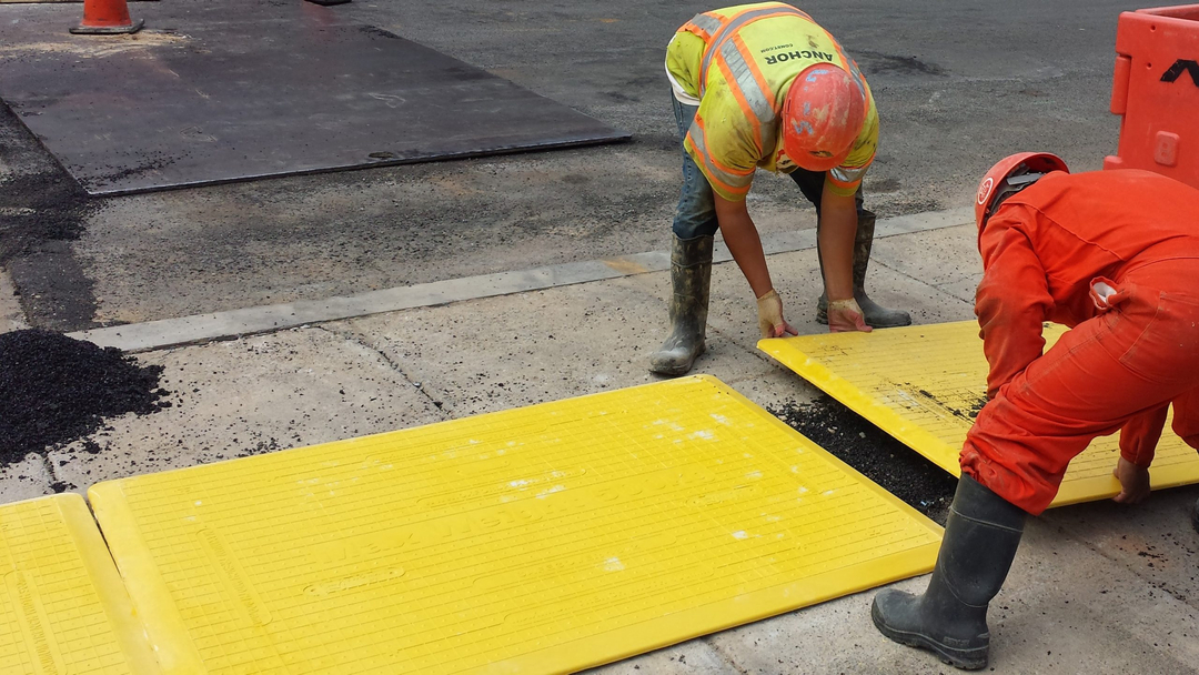 trench covers being installed