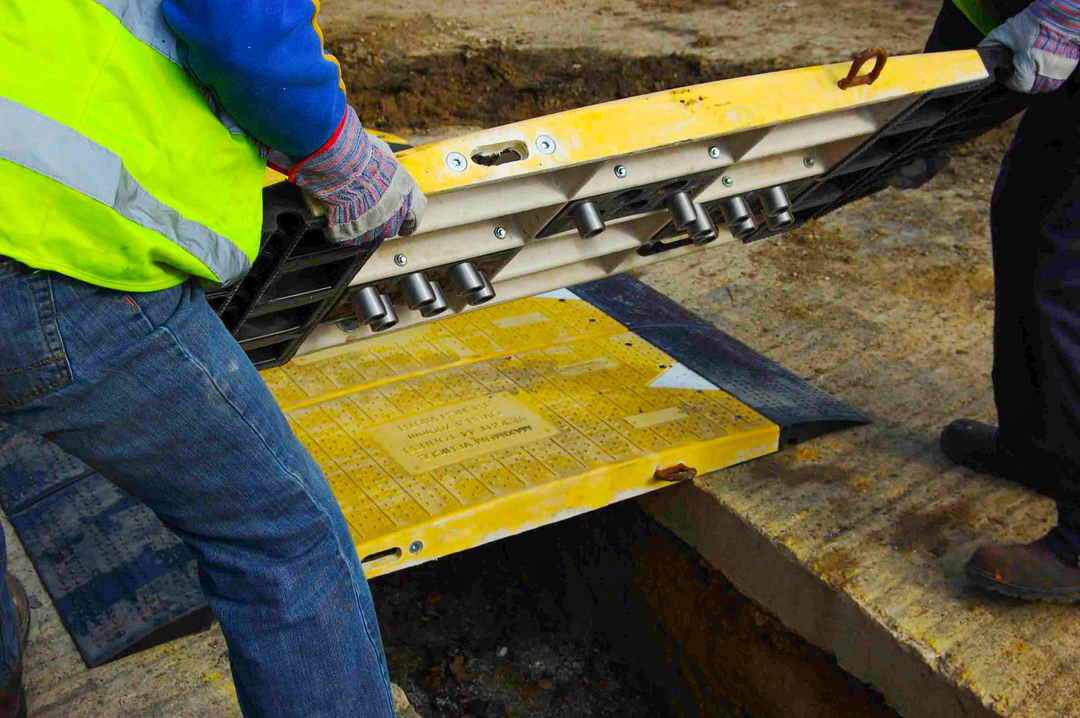 road plate being installed