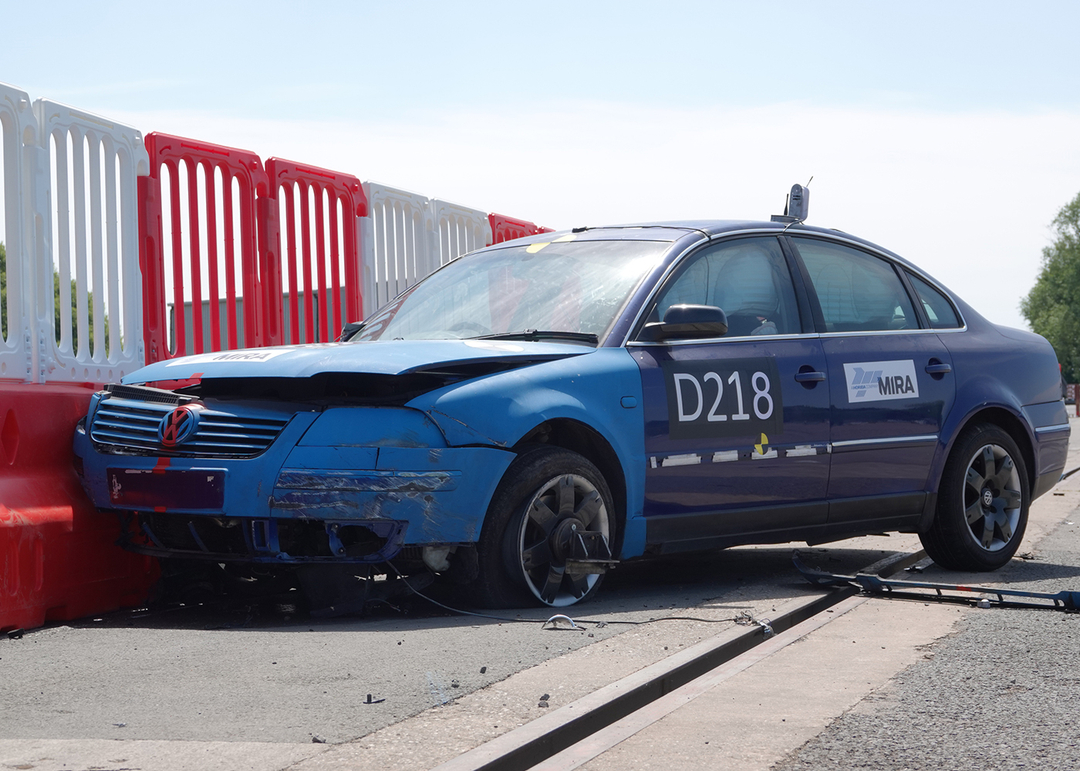 Defender 50 crash barriers having car crash into barriers for crash testing