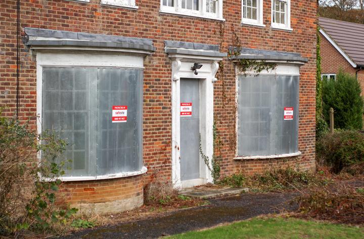 perforated steel screens installed on vacant property