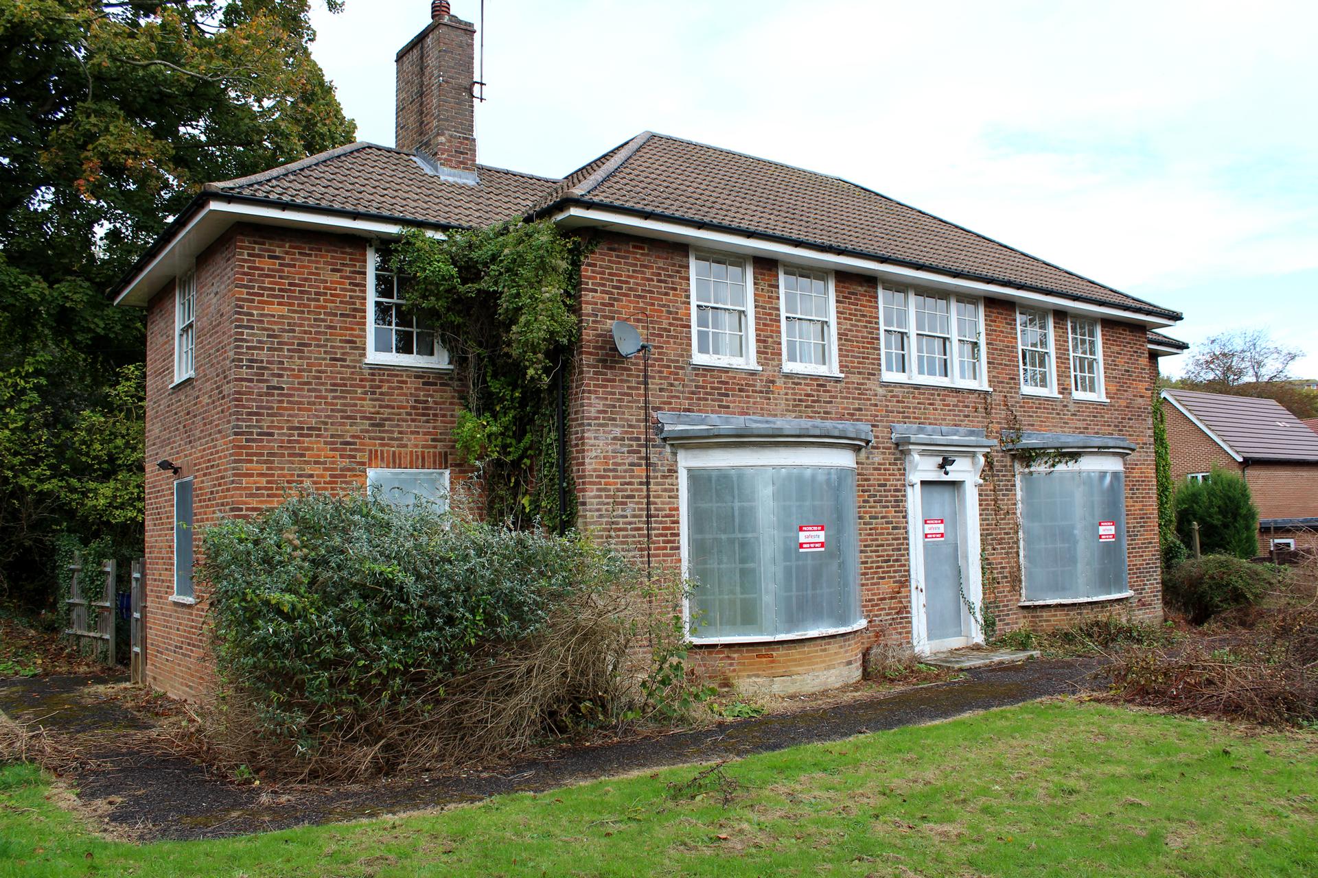 perforated steel screens installed on vacant property