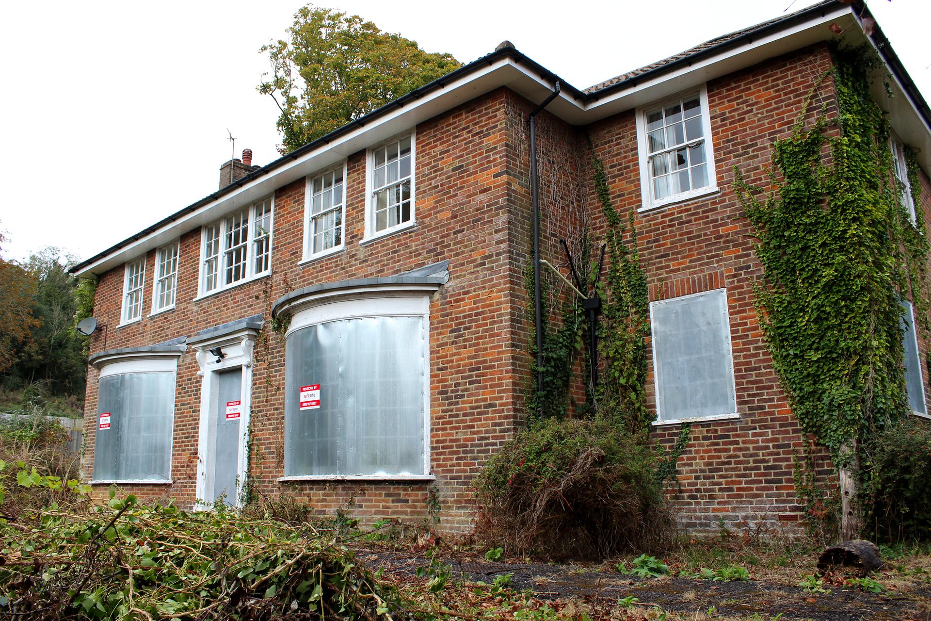 perforated steel screens installed on vacant property