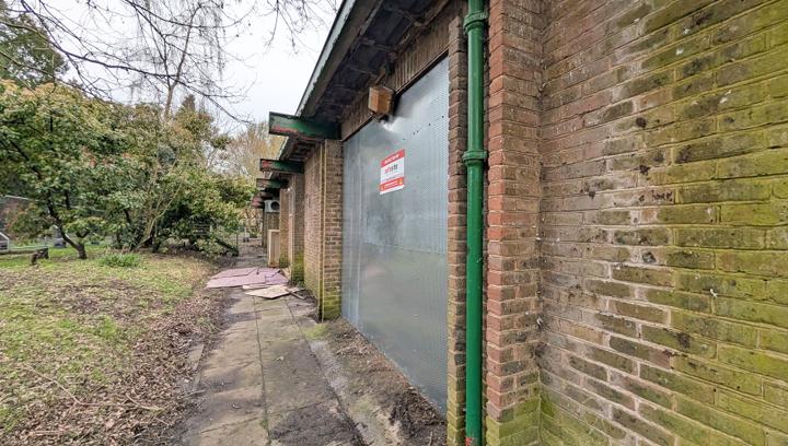 perforated steel screens installed on vacant property