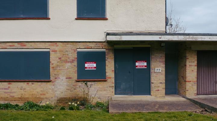 steel door and sitex screens installed on vacant property