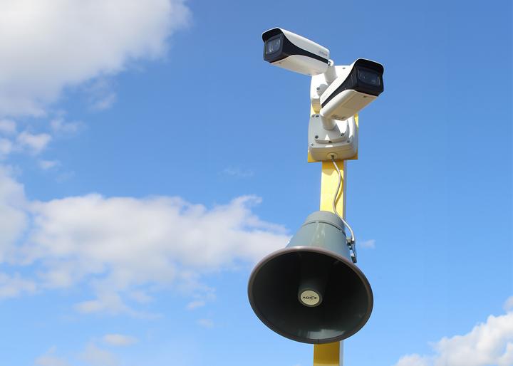 cctv attached with siren alarm on site