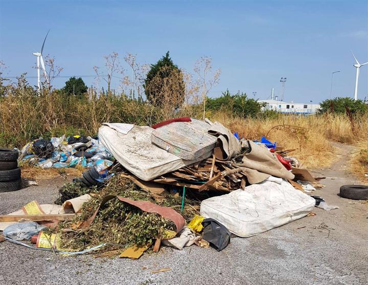 fly tipping on open site of land