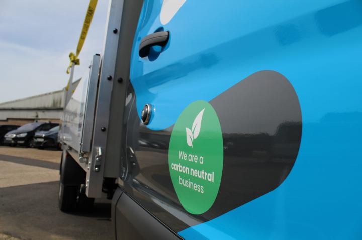 We are Carbon Neutral Green sticker on side of vehicle