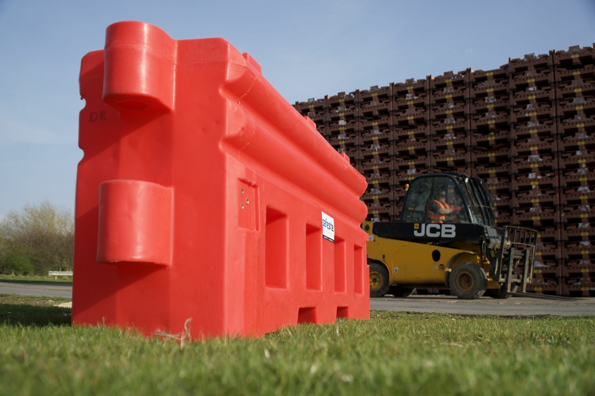 RB22 barrier in a yard with forklift