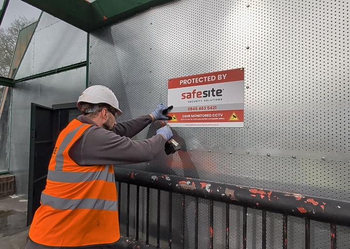perforated steel screen installing a sign