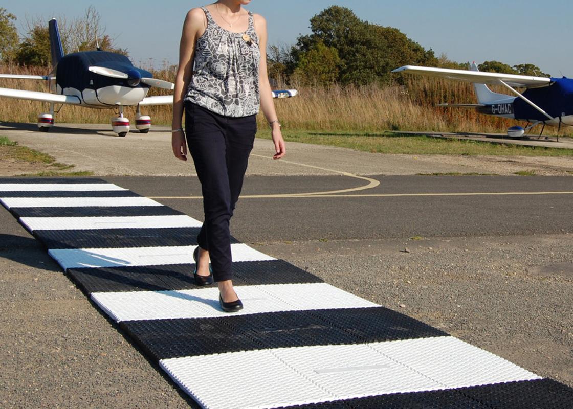 clear path walkway mat being used as pedestrian crossing