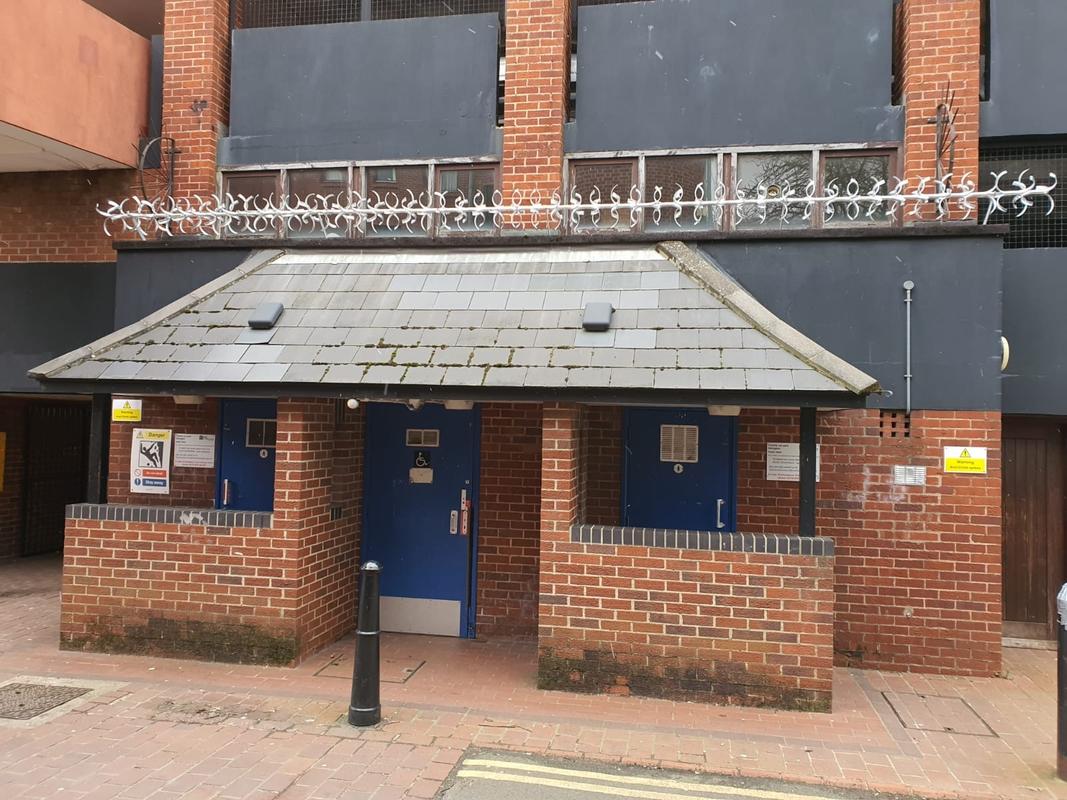 anti-climb spikes installed over a roof