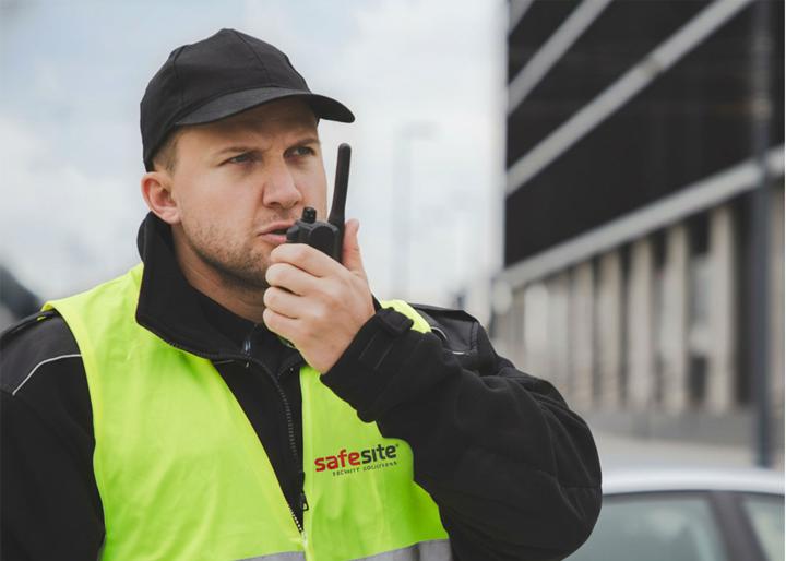 security guard using walkie talkie