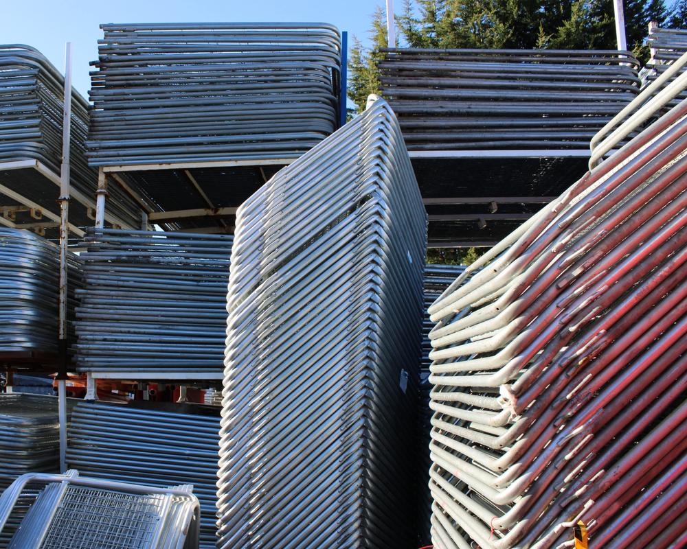 Stacked used police barriers