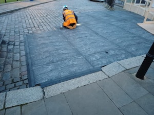 SafeSite operative installing ground mats