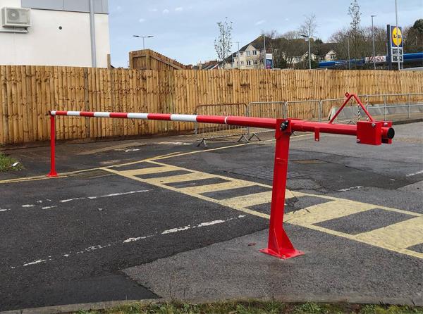 Manual Arm Barrier preventing unrestricted access to supermarket lorry bays