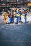 A group of people wearing PPE on a construction site