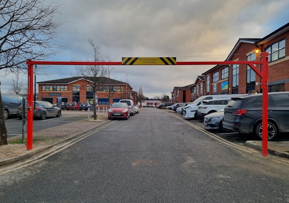 Height Restrictor barrier preventing large vehicles from entering small public carpark