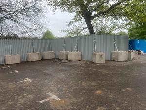 steel hoarding with concrete blocks