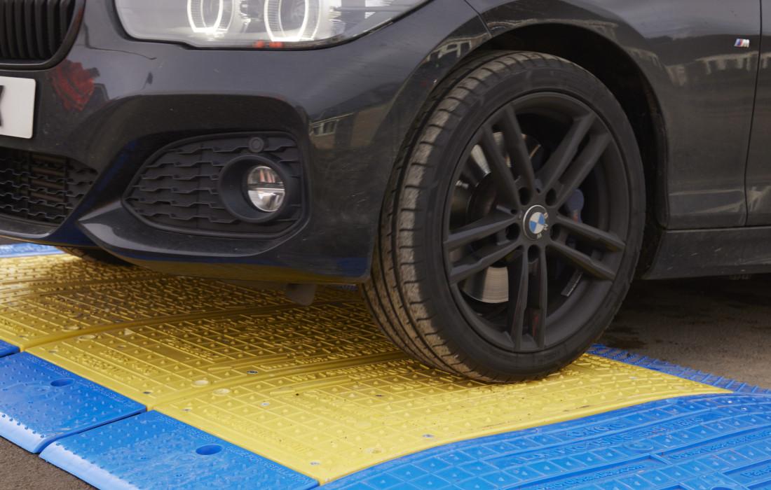 GRP Road Plates 1500mm on road with vehicle driving over it