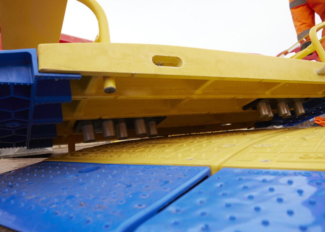 GRP Road Plate Lifting Handles being used to manoeuvre road plates on ground