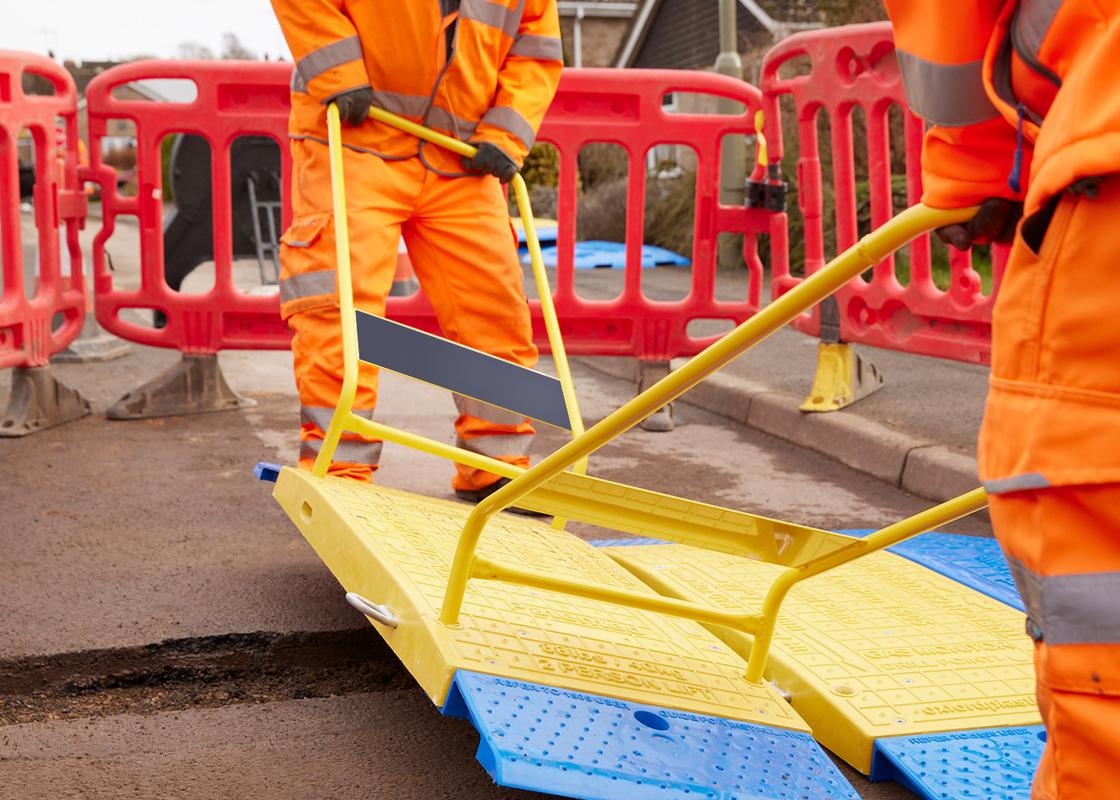 GRP Road Plate Lifting Handles being used to manoeuvre road plates on ground