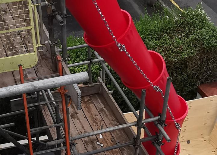 20 inch rubbish chutes attached to building and scaffolding