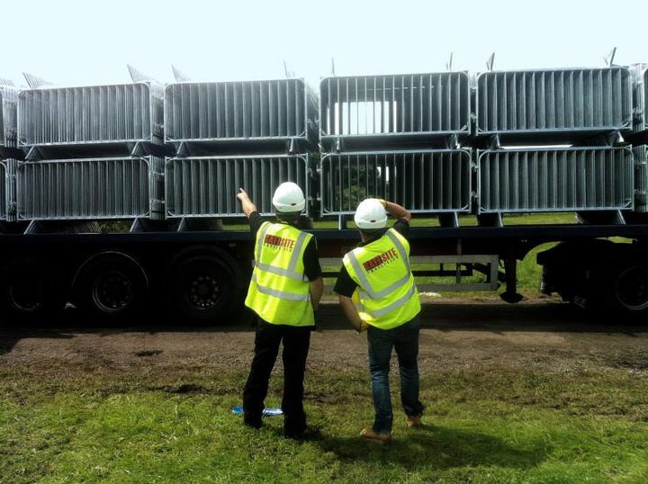 history pic of safesite staff managing a load of pedestrian barriers