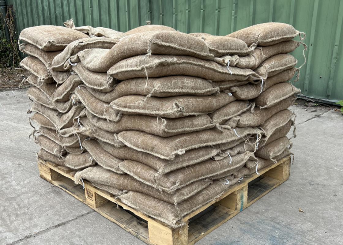 Hessian Pre-Filled Sandbags on a wooden pallet
