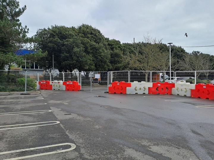 bison barriers used supermarket carpark with heras fencing