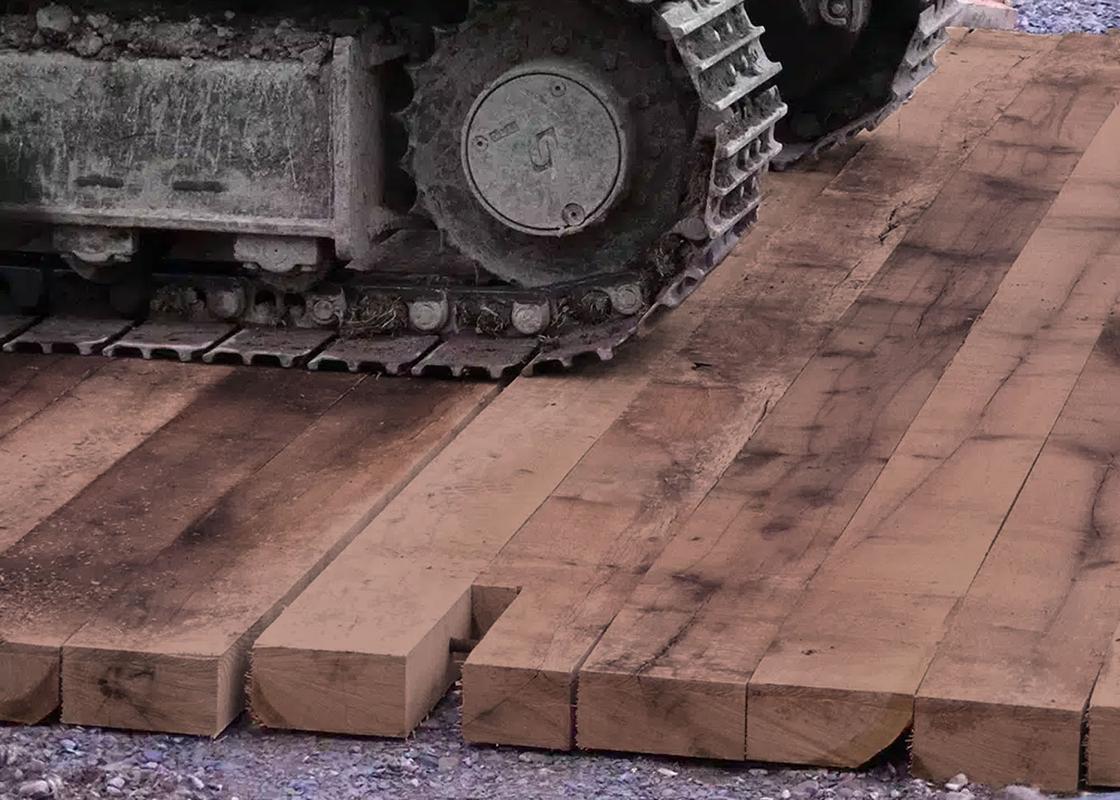 Plant machinery on a Ekki Bog Mat made of hardwood