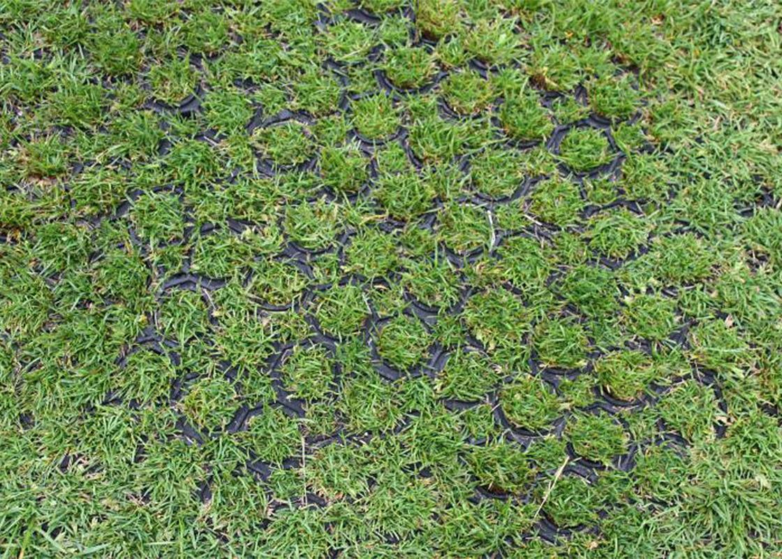 rubber grass mat close up of installed in grass