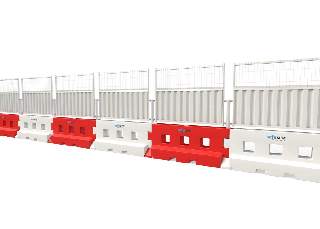Line of GB2 water filled barriers with half mesh and half hoarding fencing