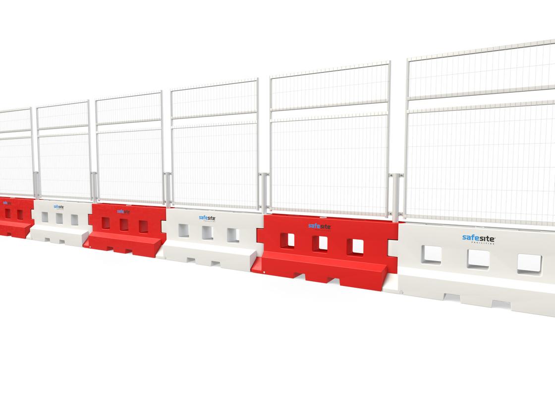 Line of GB2 water filled barriers with mesh fencing with a mesh extension