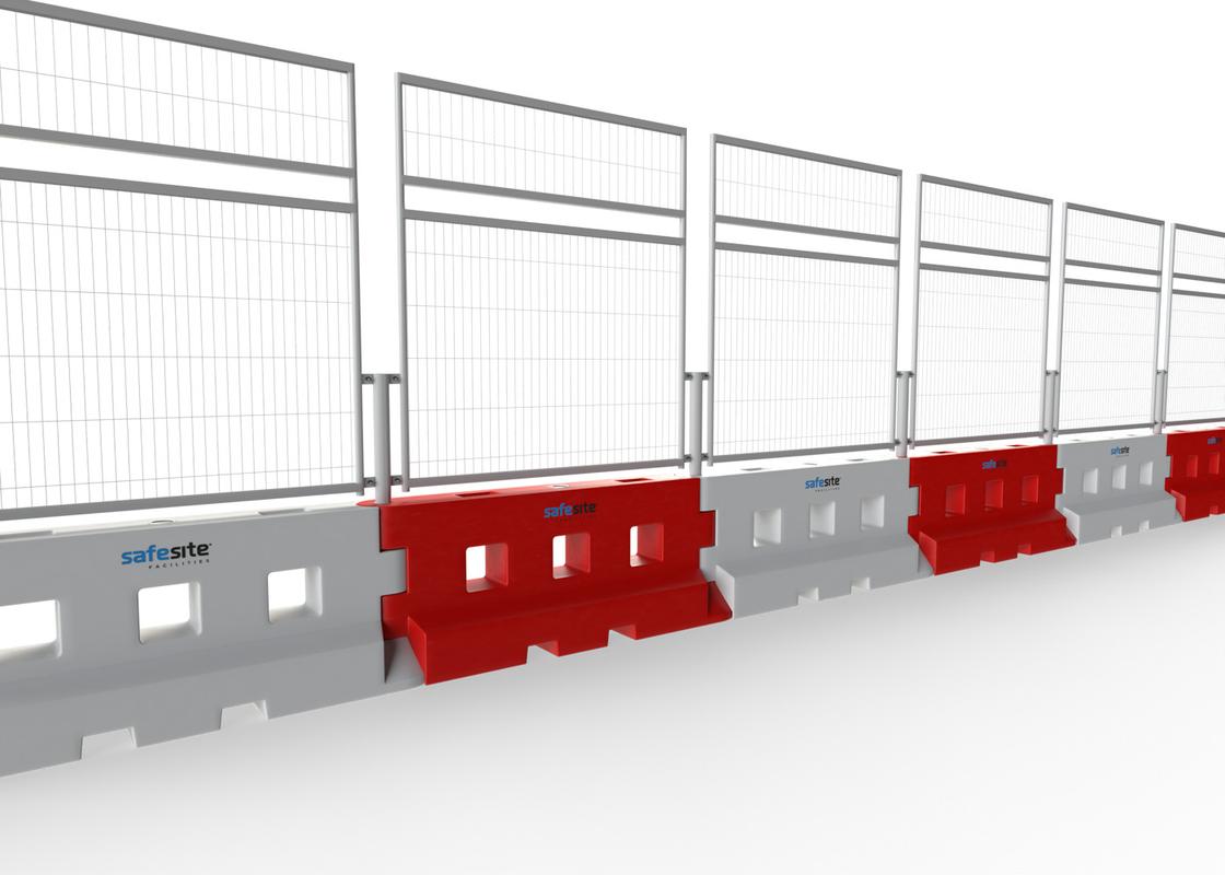 Line of GB2 water filled barriers with mesh fencing with a mesh extension from the reverse side