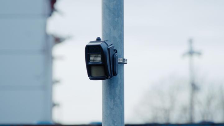 wireless vacant property alarm attached to pole