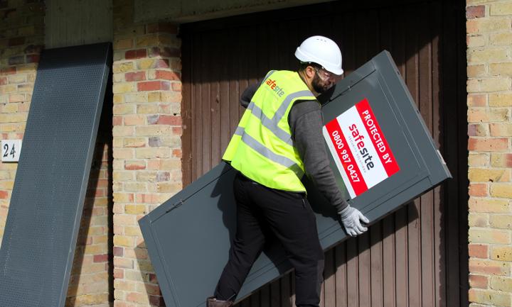steel security door being installed