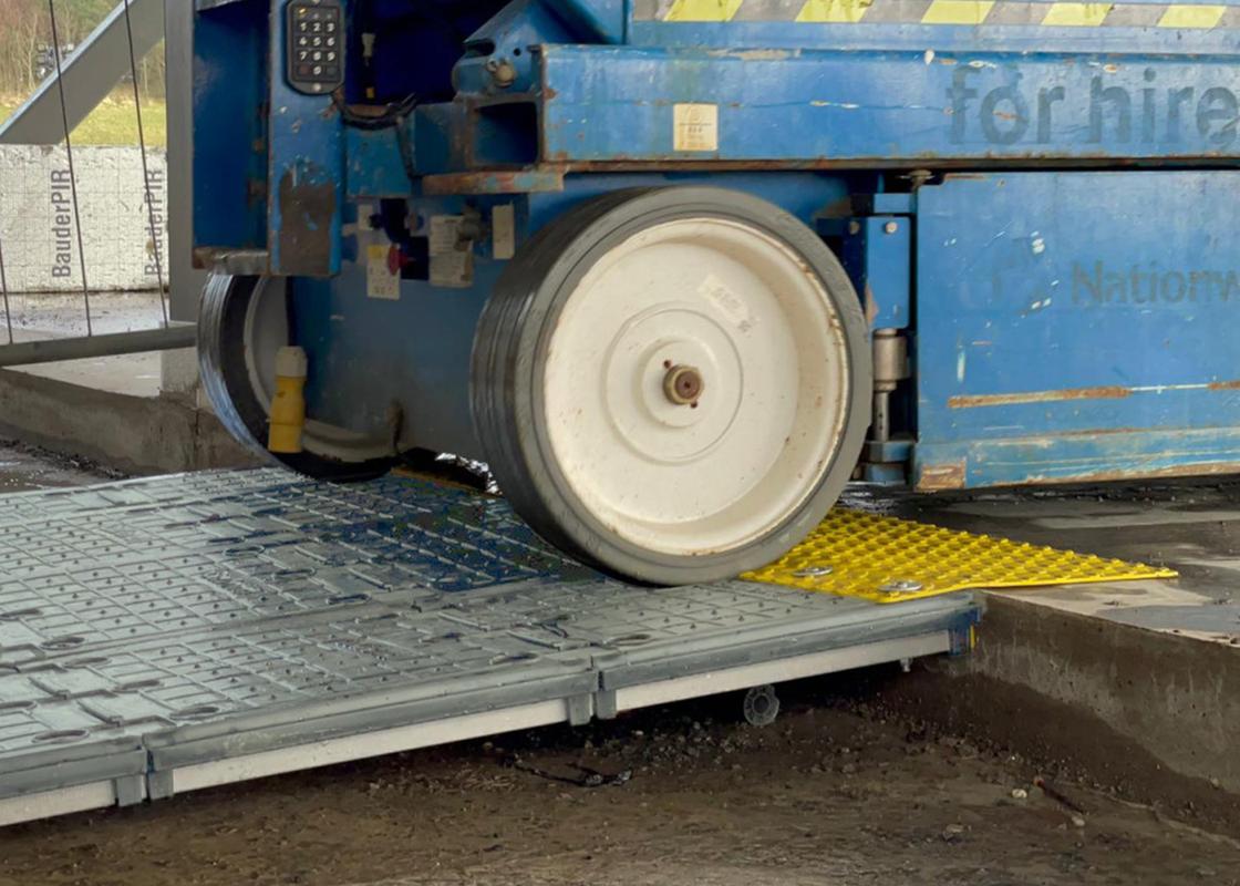 supersite ramp installed and being used with a vehicle driving over ramp