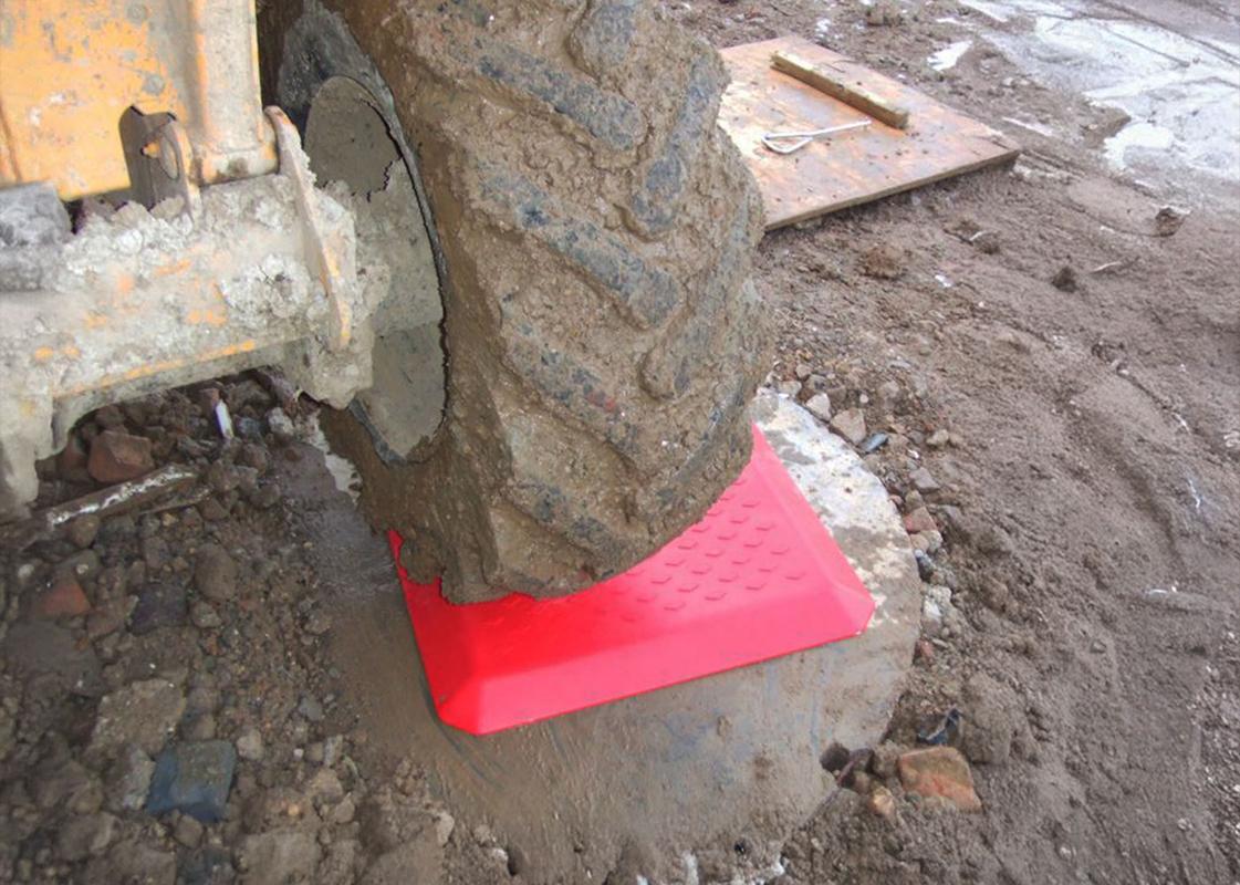 heavy plant vehicle driving over a Temporary Manhole Cover