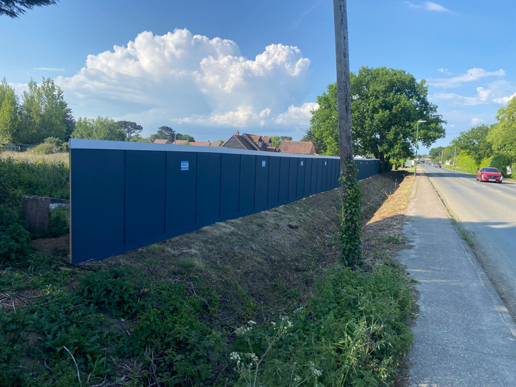 in ground timber hoarding on site