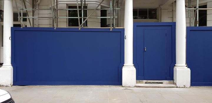 timber hoarding with door