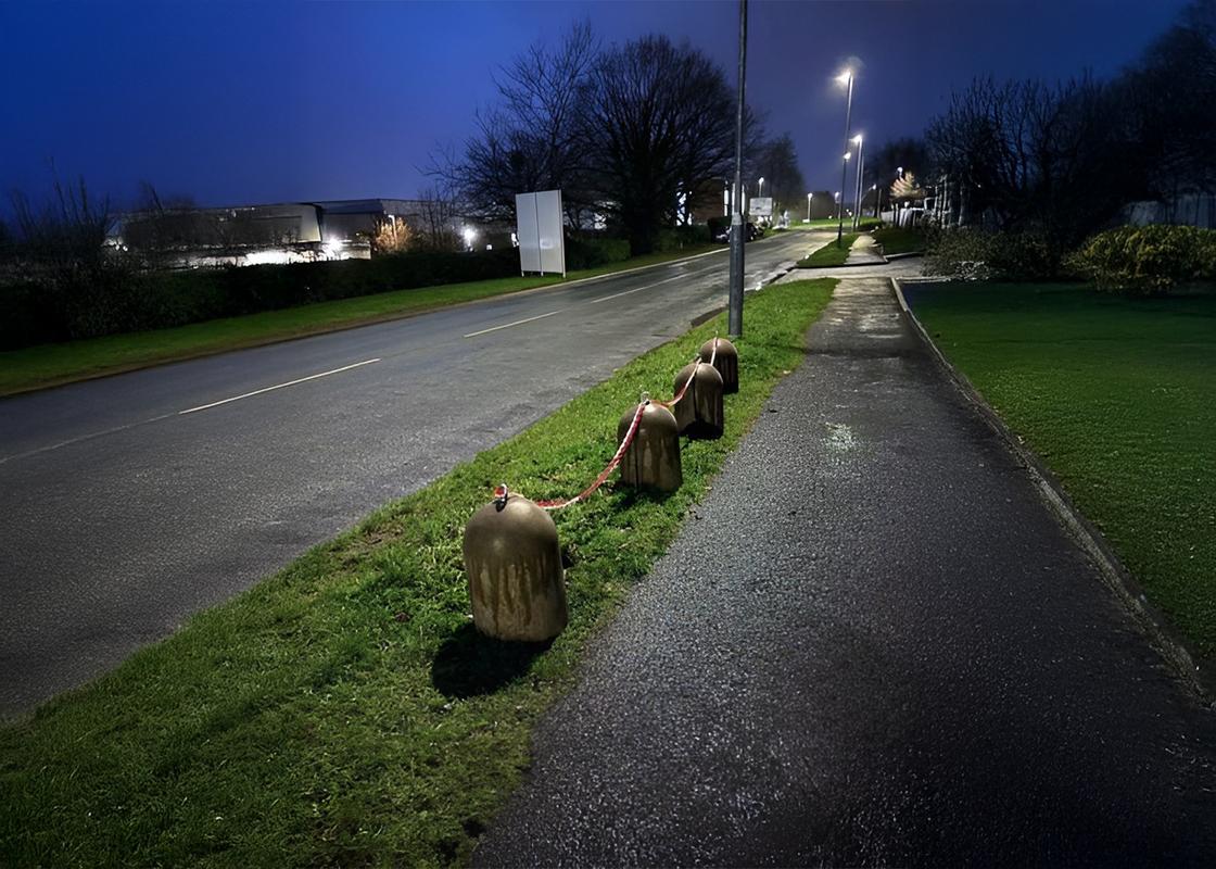 concrete stub bollard in situ with barrier chains connecting bollards