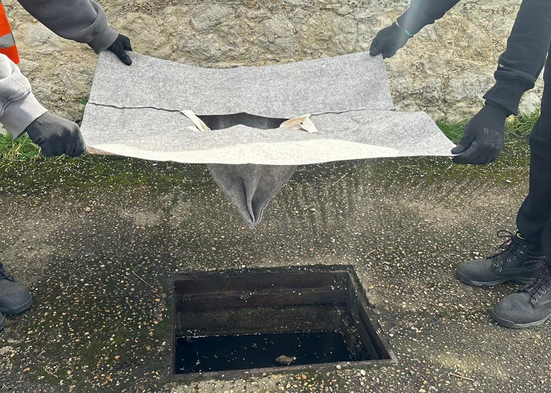 biodegradable drain guard being installed