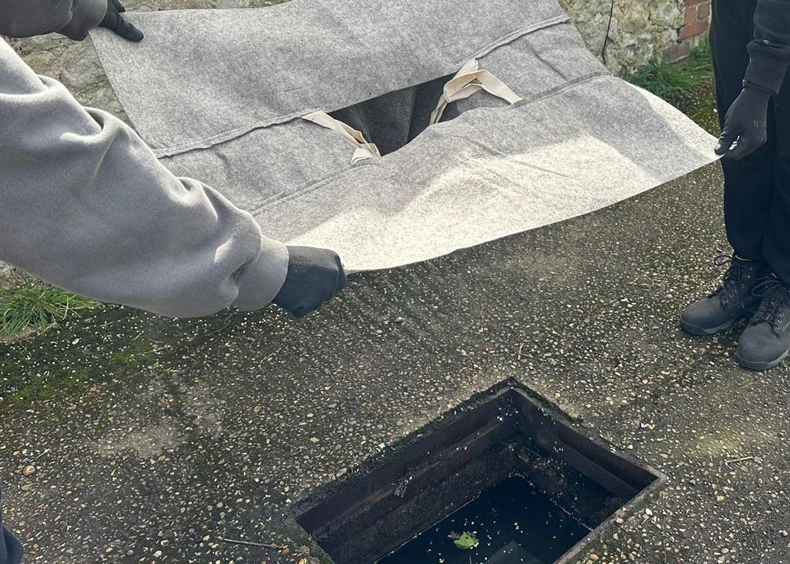 biodegradable drain guard being installed