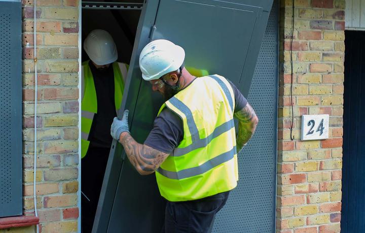 steel doors being installed by installs team