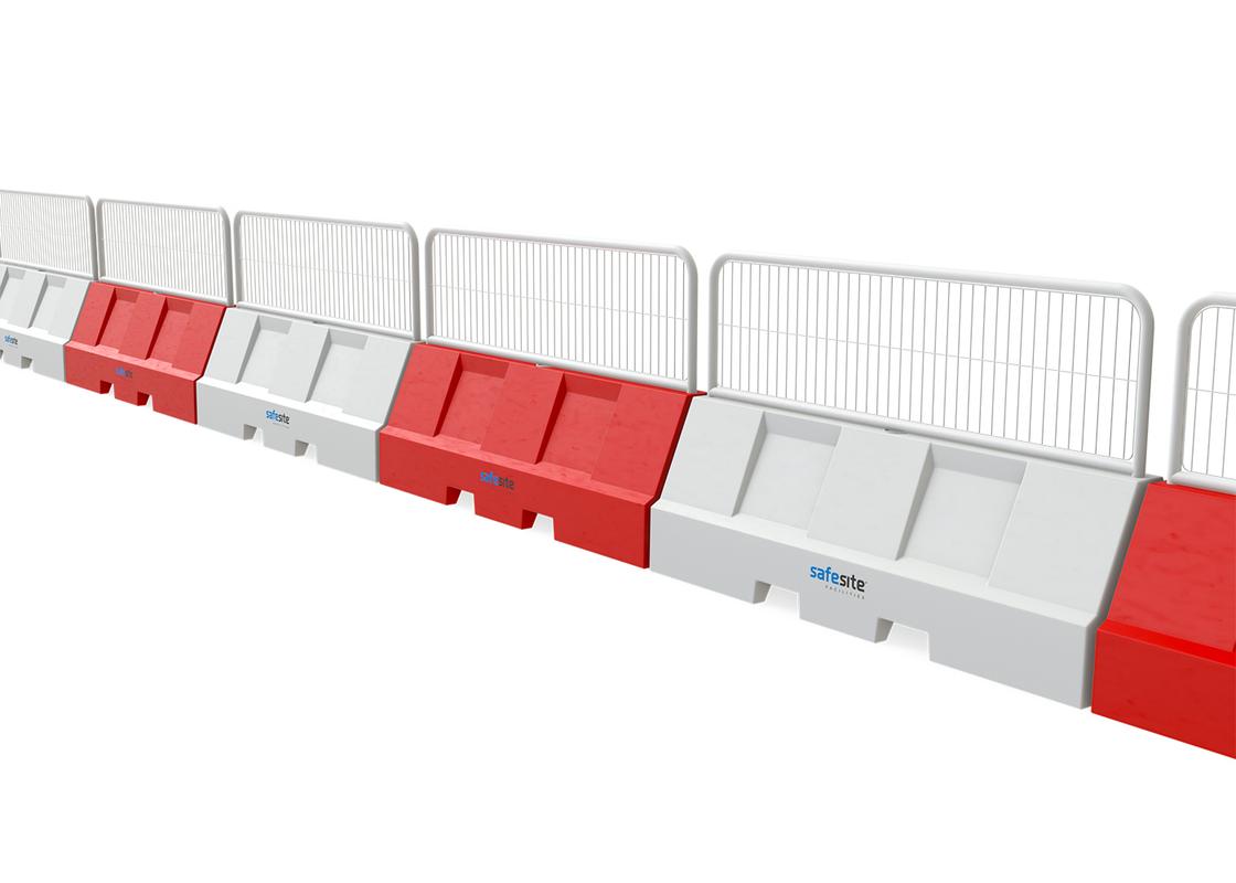 line of euro 2m red and white barriers connected with mesh