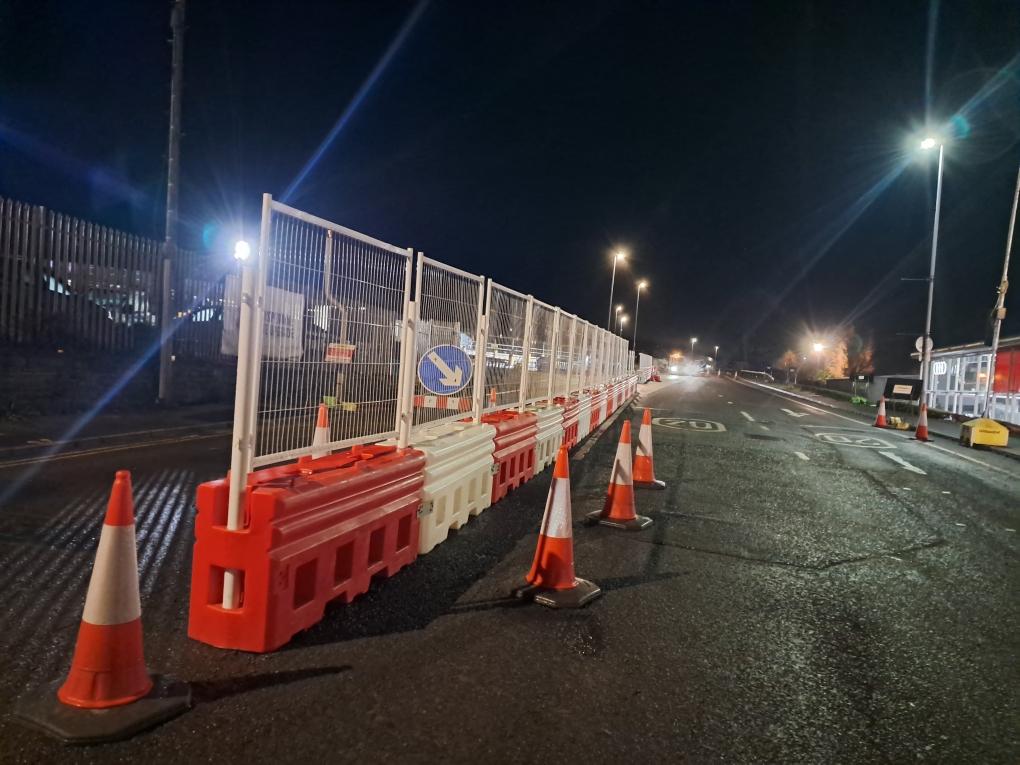 RB22 barrier installed with Mesh Fencing at night